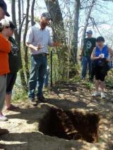 Tim Messner and his archaeology students craft a canoe